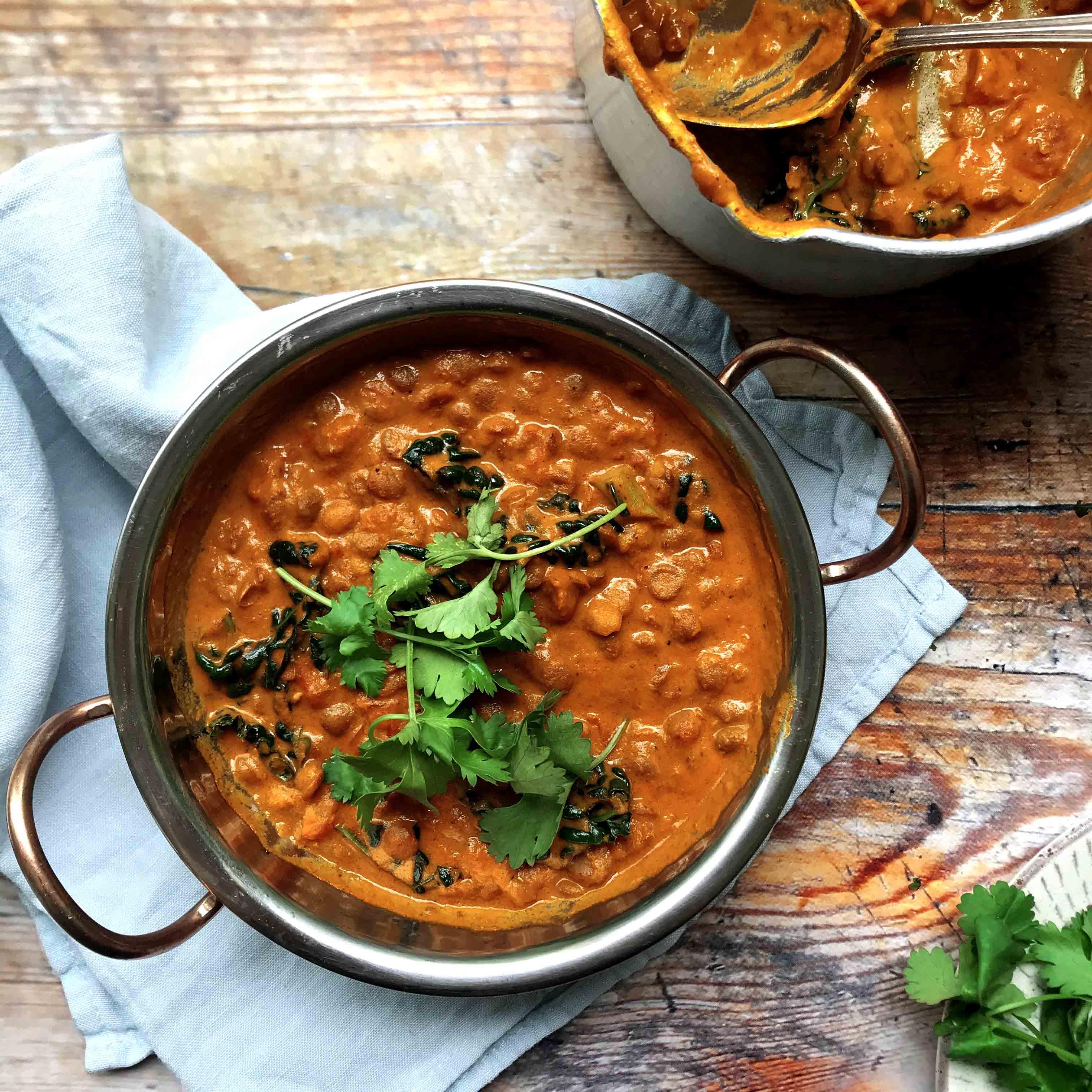 Creamy tomato and coconut dhal with cavolo nero